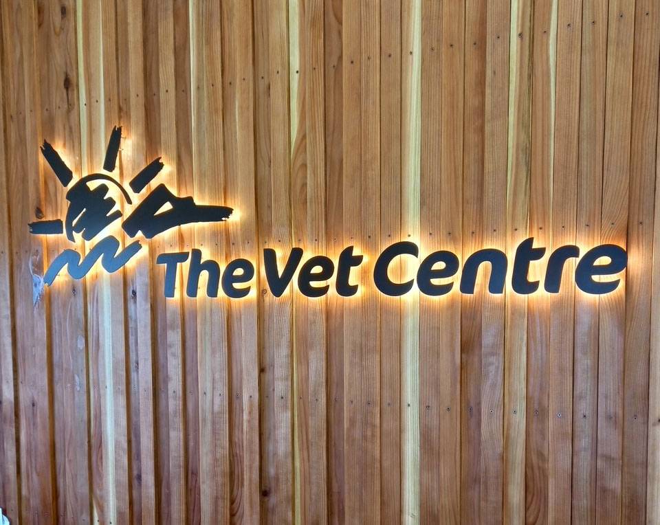 The Vet Centre sign on wooden wall